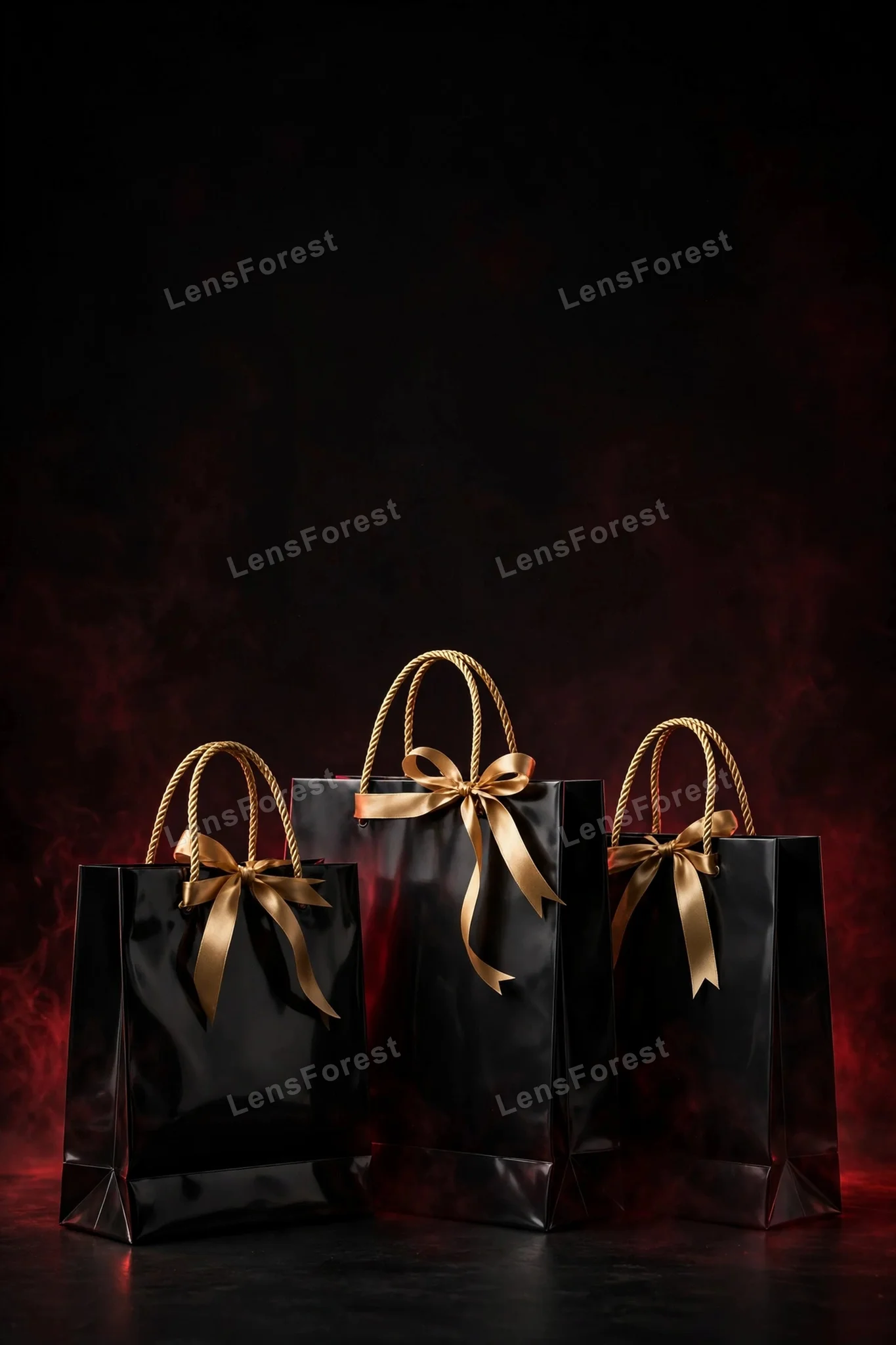 Three glossy black shopping bags with gold rope handles and gold ribbon bows on a black backdrop with subtle deep-red glow and large empty copy space above